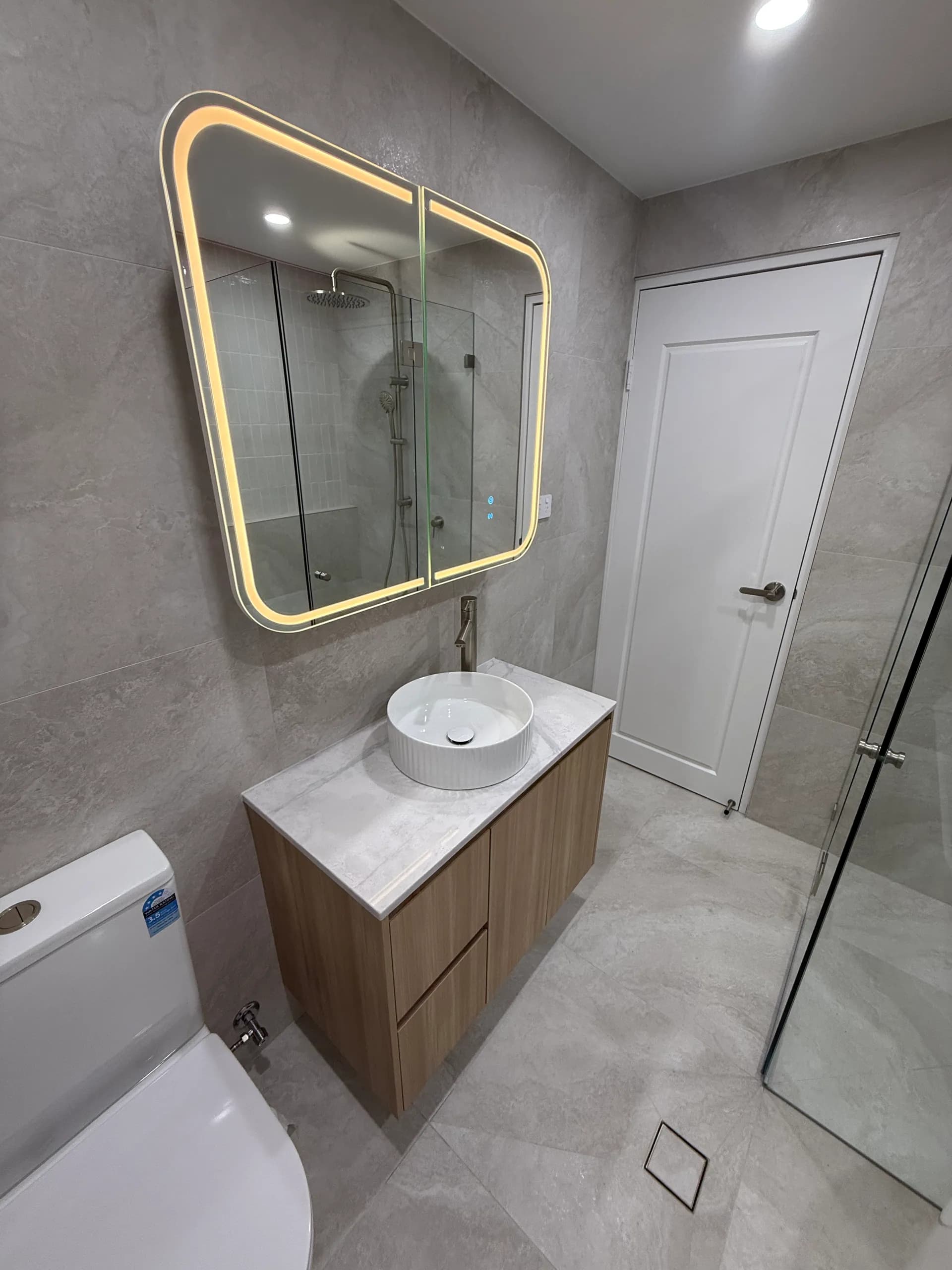 Modern bathroom with LED mirror cabinet