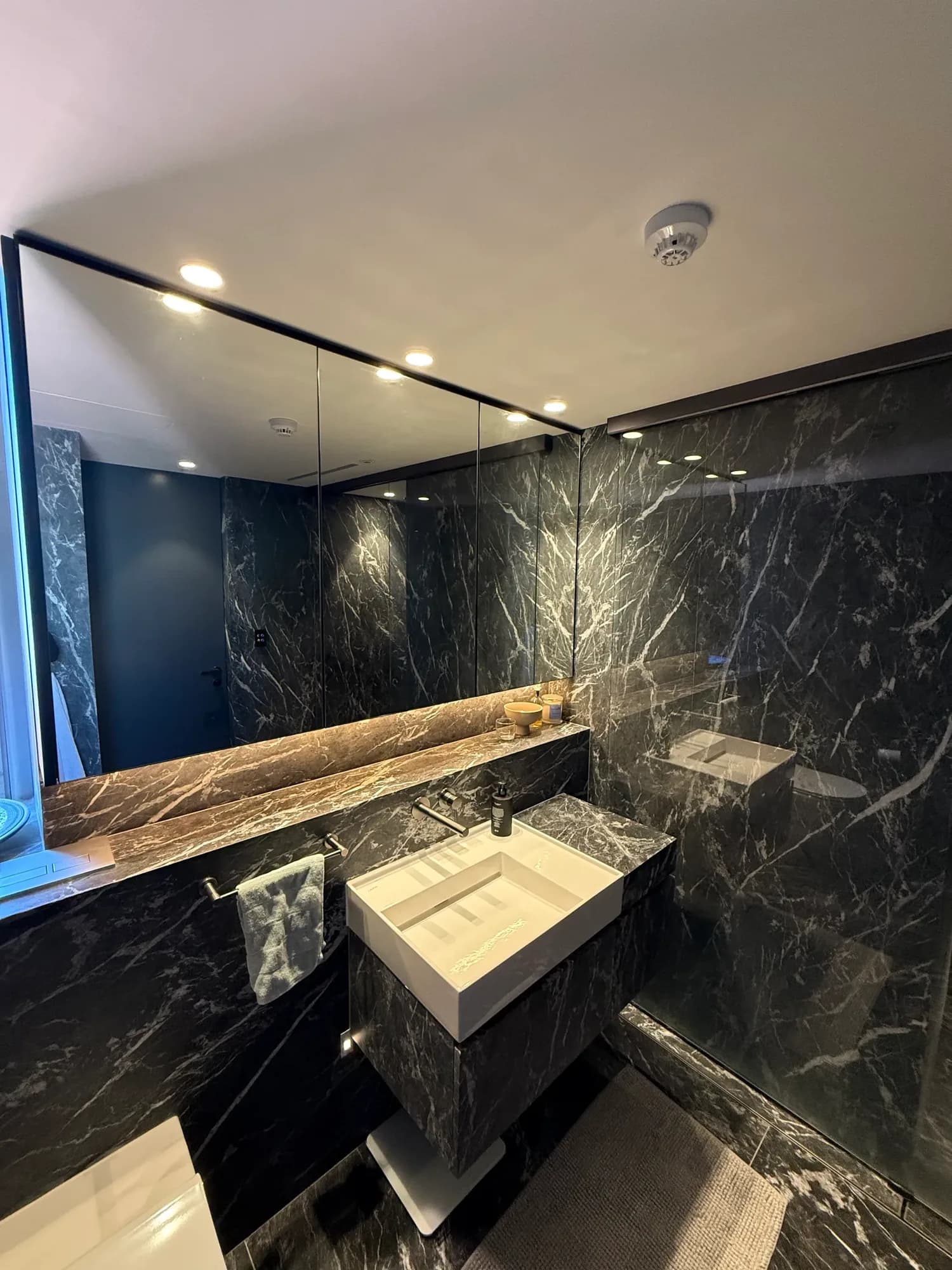 Luxury bathroom with dark marble vanity