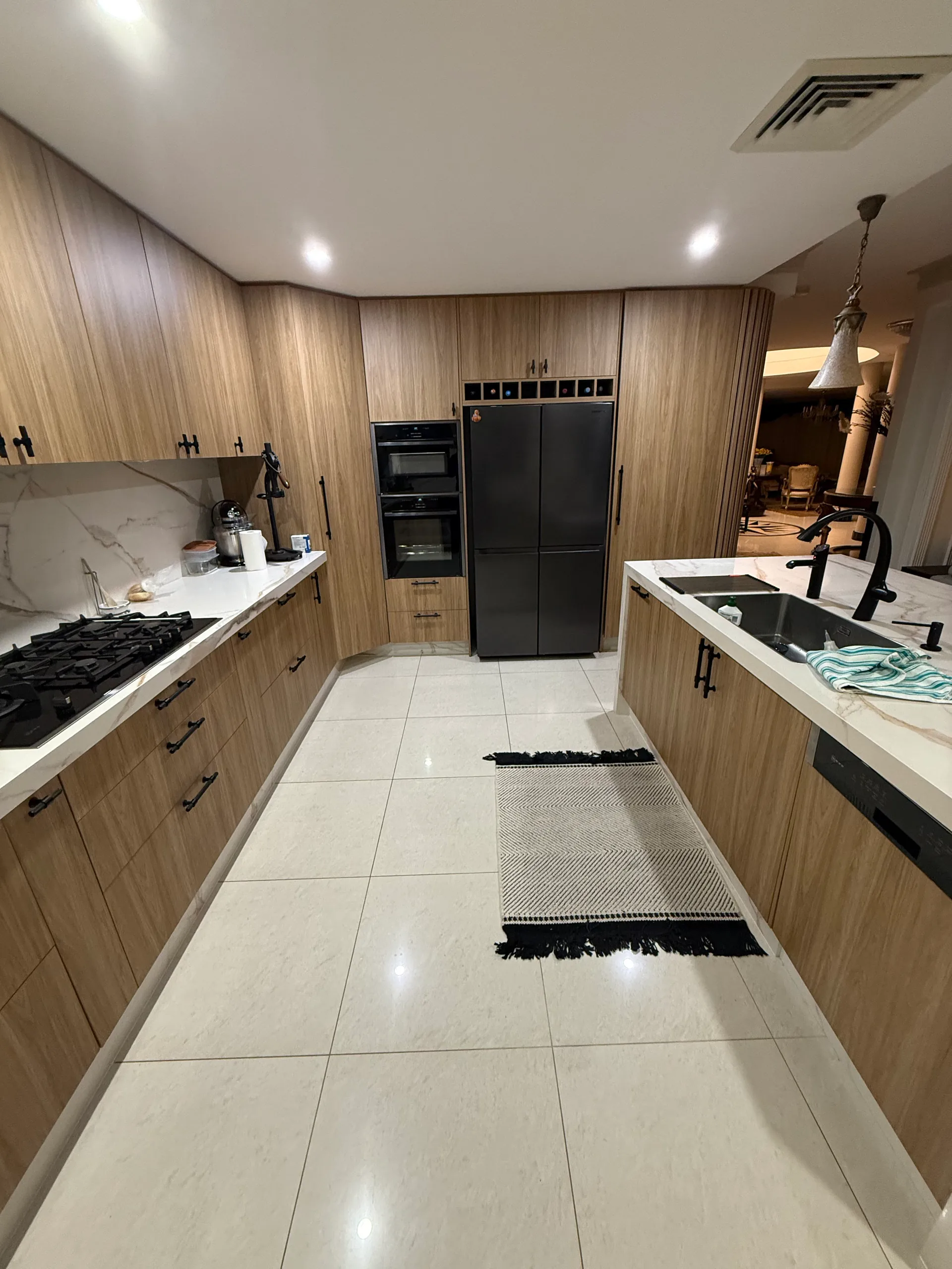 Wide view of timber kitchen with island bench