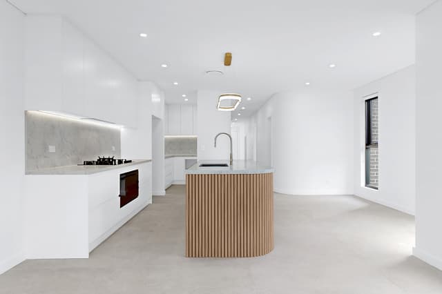 Greenacre apartment kitchen renovation with modern cabinetry and stone benchtops