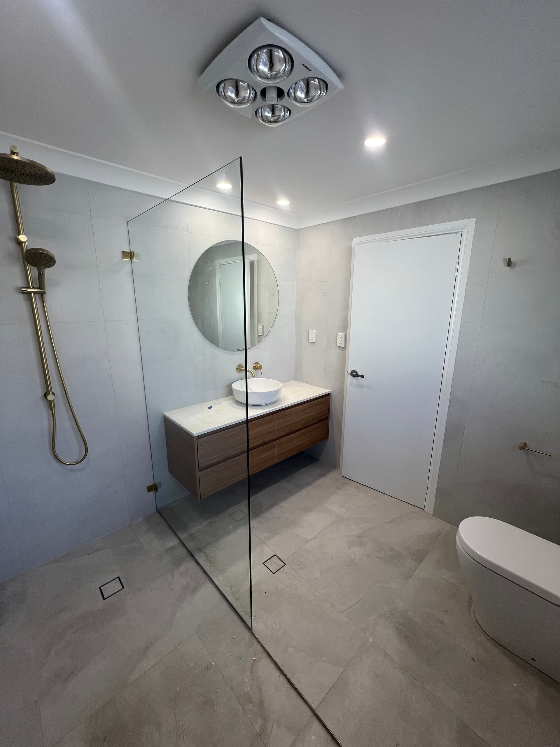 Flood testing waterproofed bathroom floor in Sydney apartment renovation