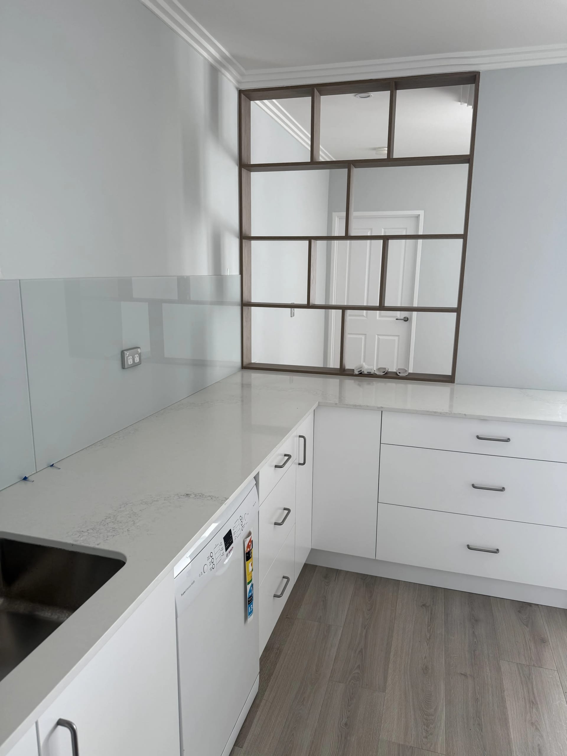 Modern kitchen with dark shelving