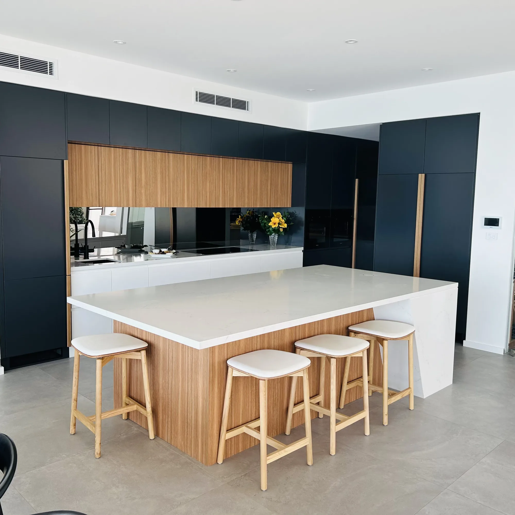 Well-lit modern apartment kitchen with island