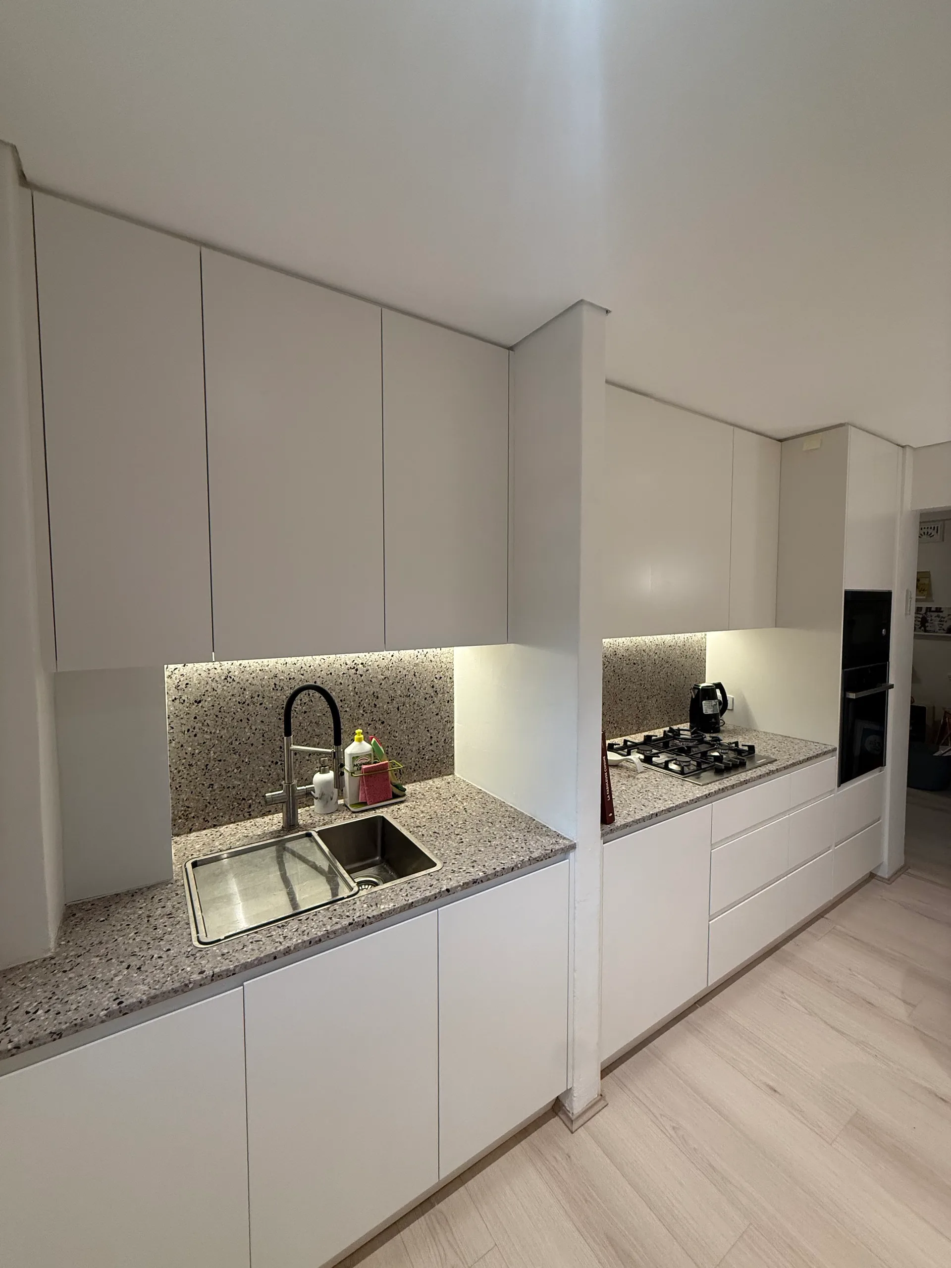 Apartment kitchen renovation in Sydney with stone benchtops and modern cabinetry