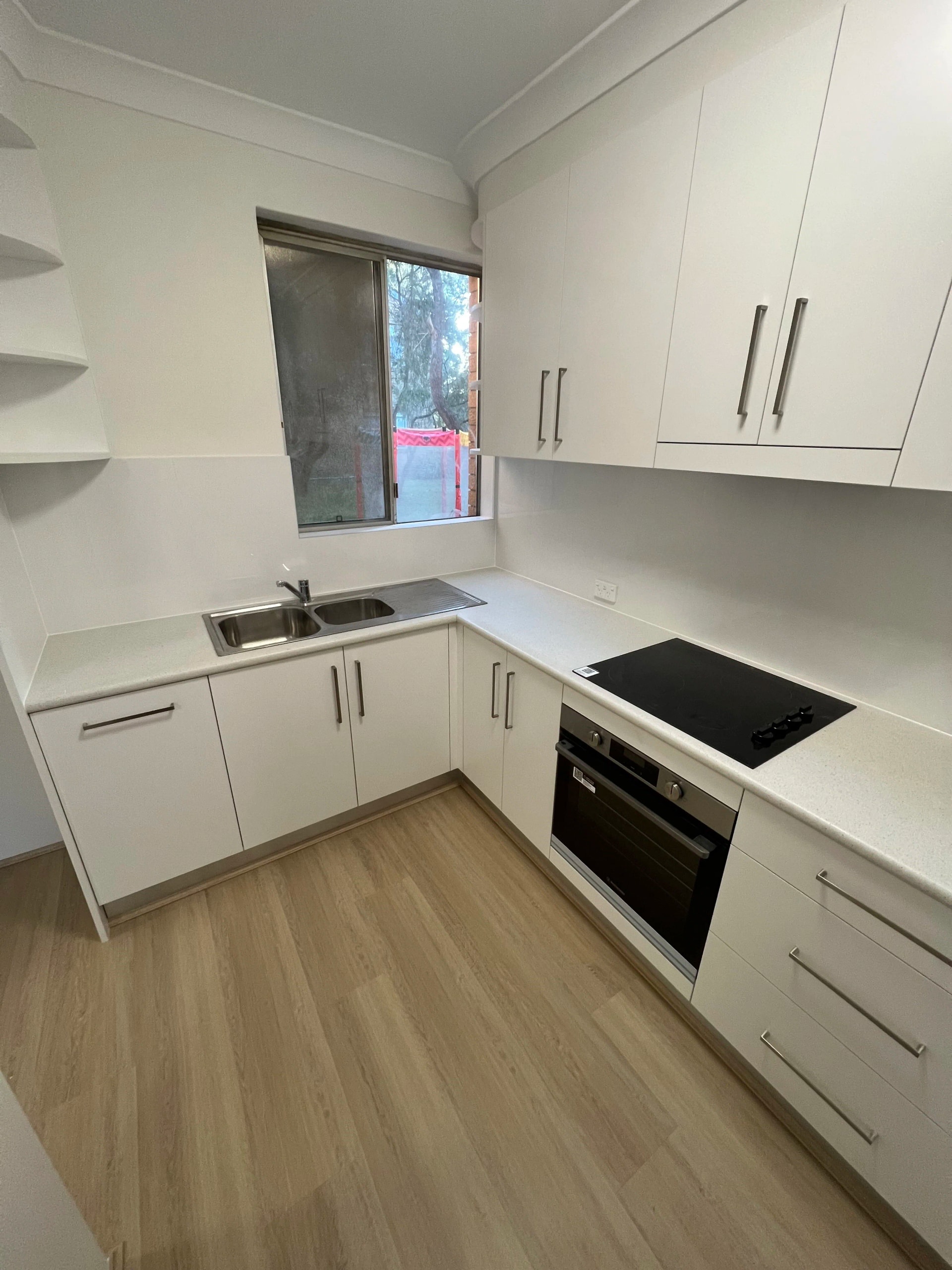 L-shaped white kitchen
