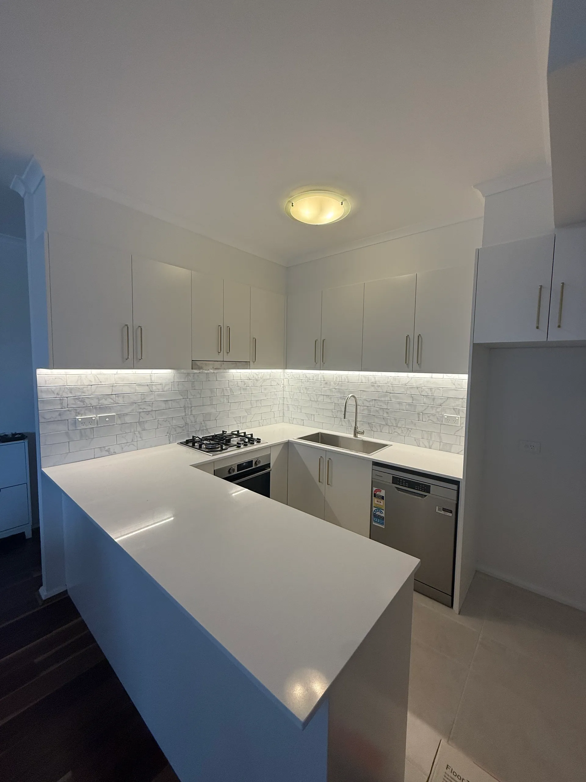 Kitchen bench and integrated fridge space