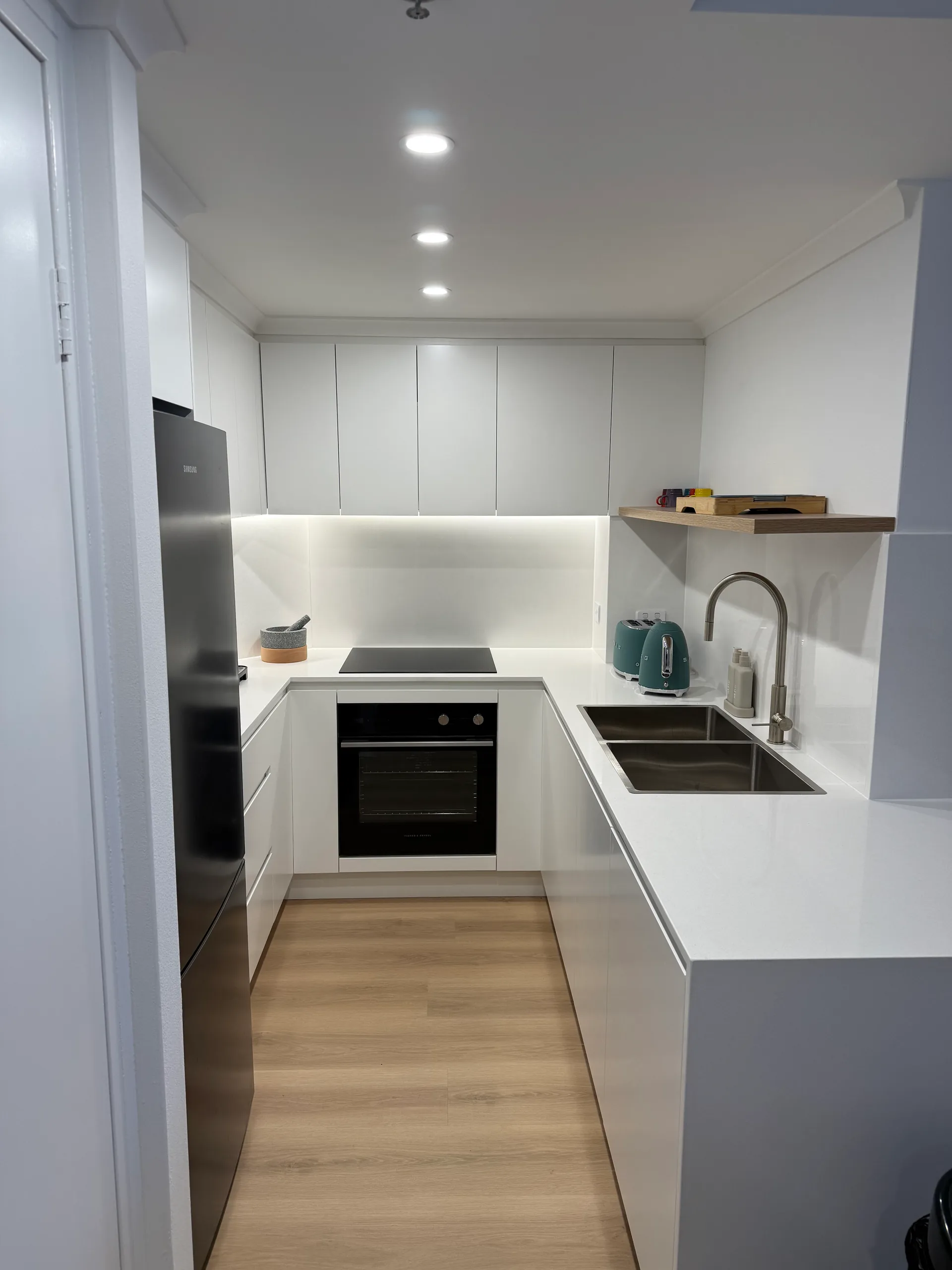 Kitchen sink area with modern tapware