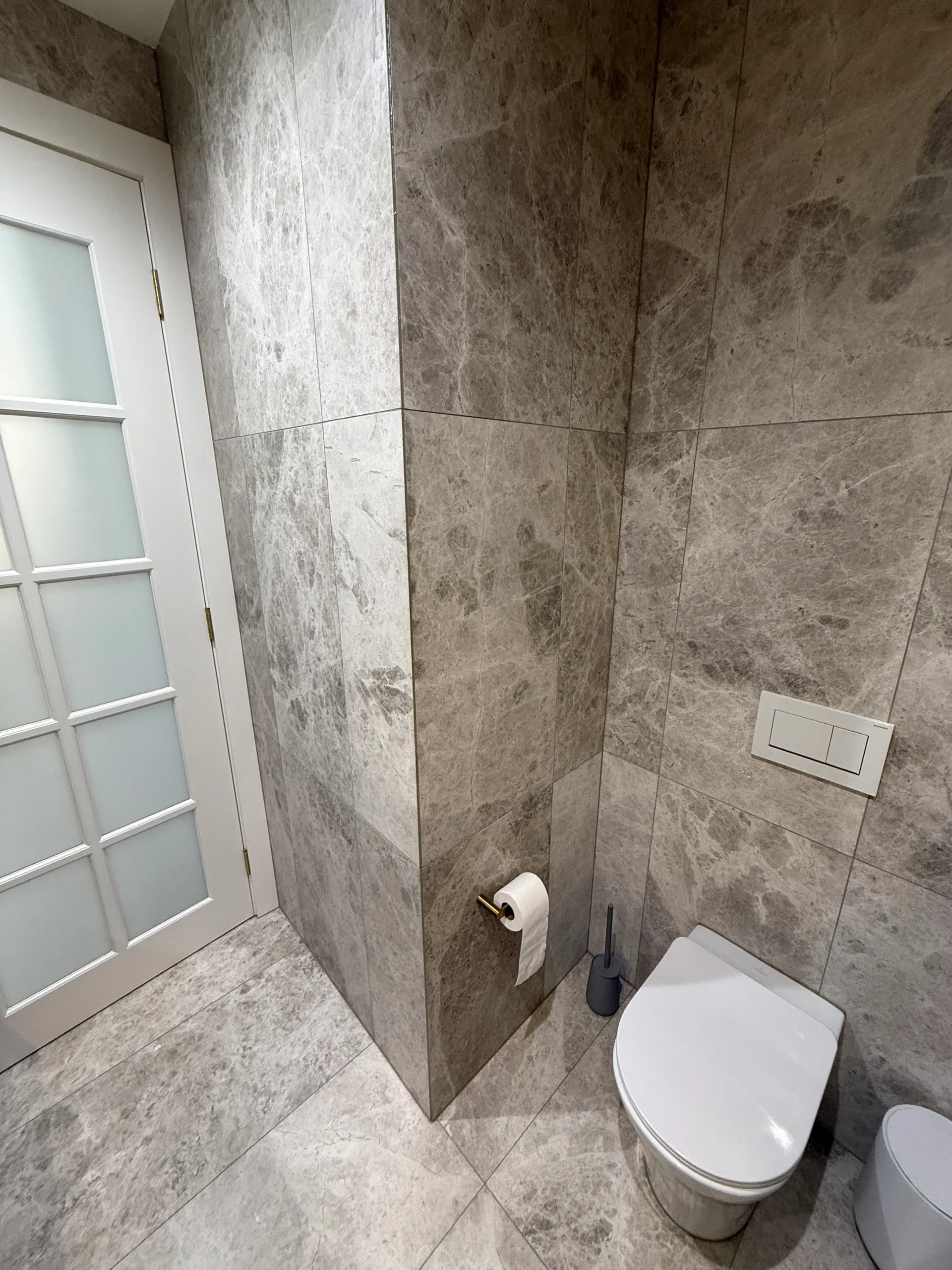 Toilet area with grey marble