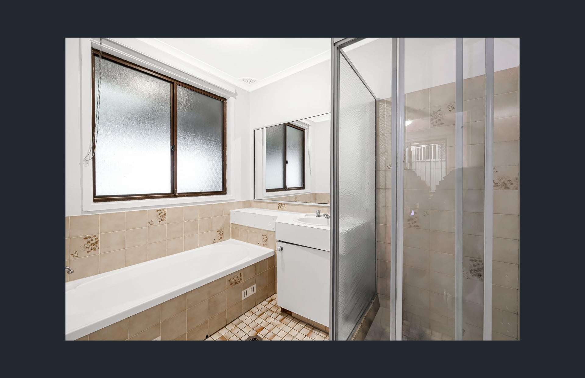 Dated bathroom before renovation