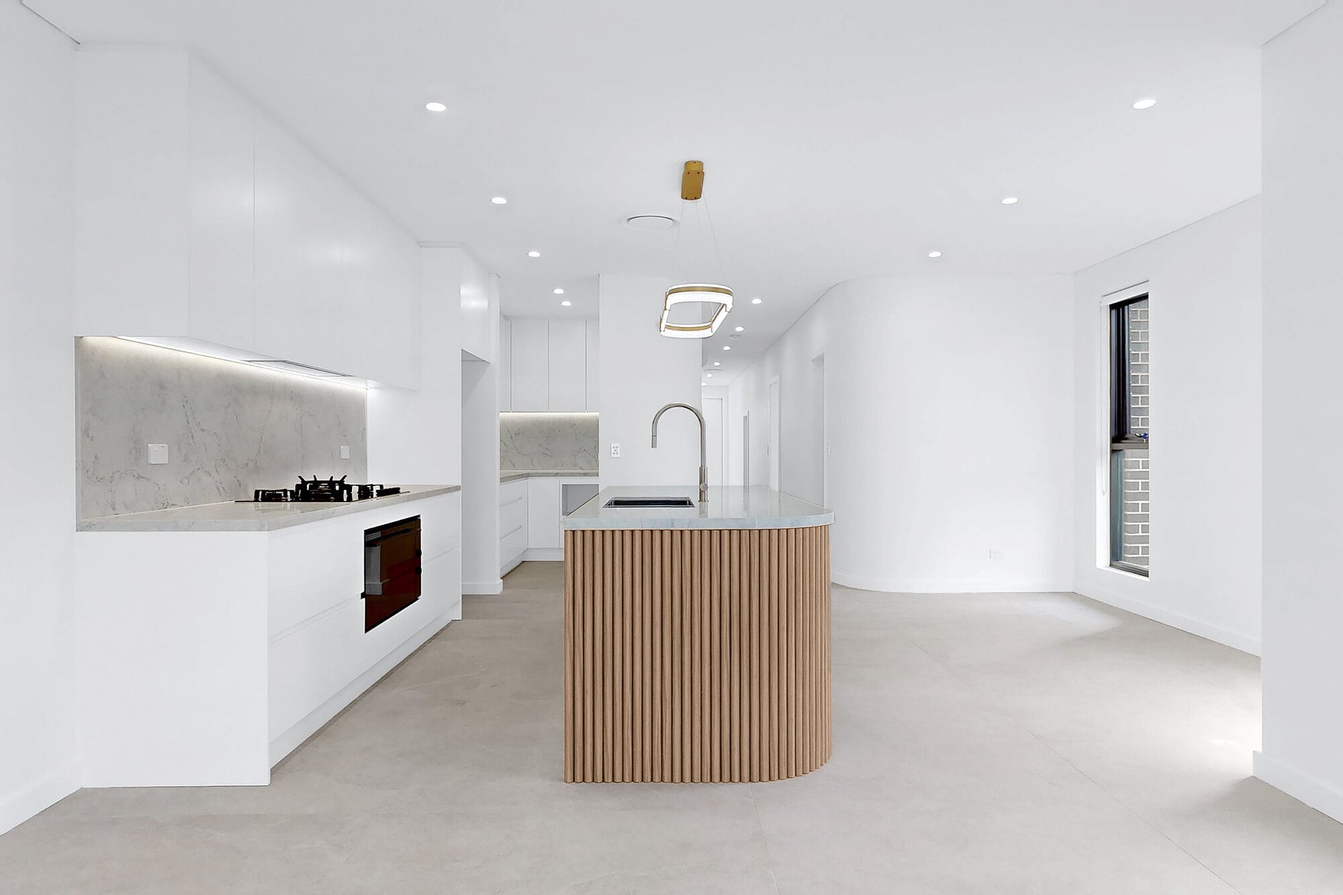 Renovated Greenacre home kitchen with a fluted timber island
