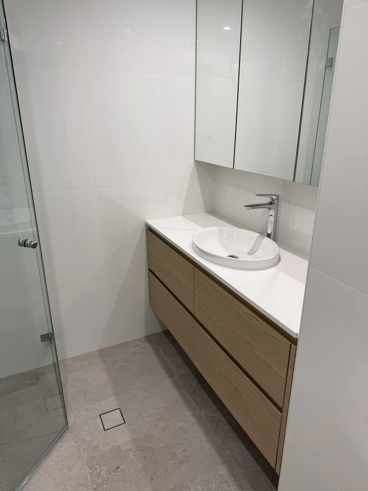 Renovated compact Pyrmont apartment bathroom with floating oak vanity and round basin