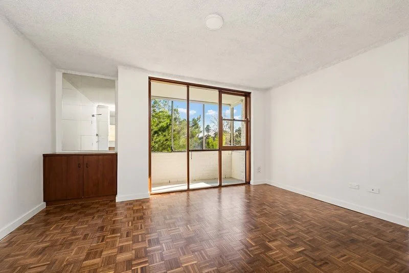 Completed apartment renovation in Randwick, with original parquet flooring in the living room